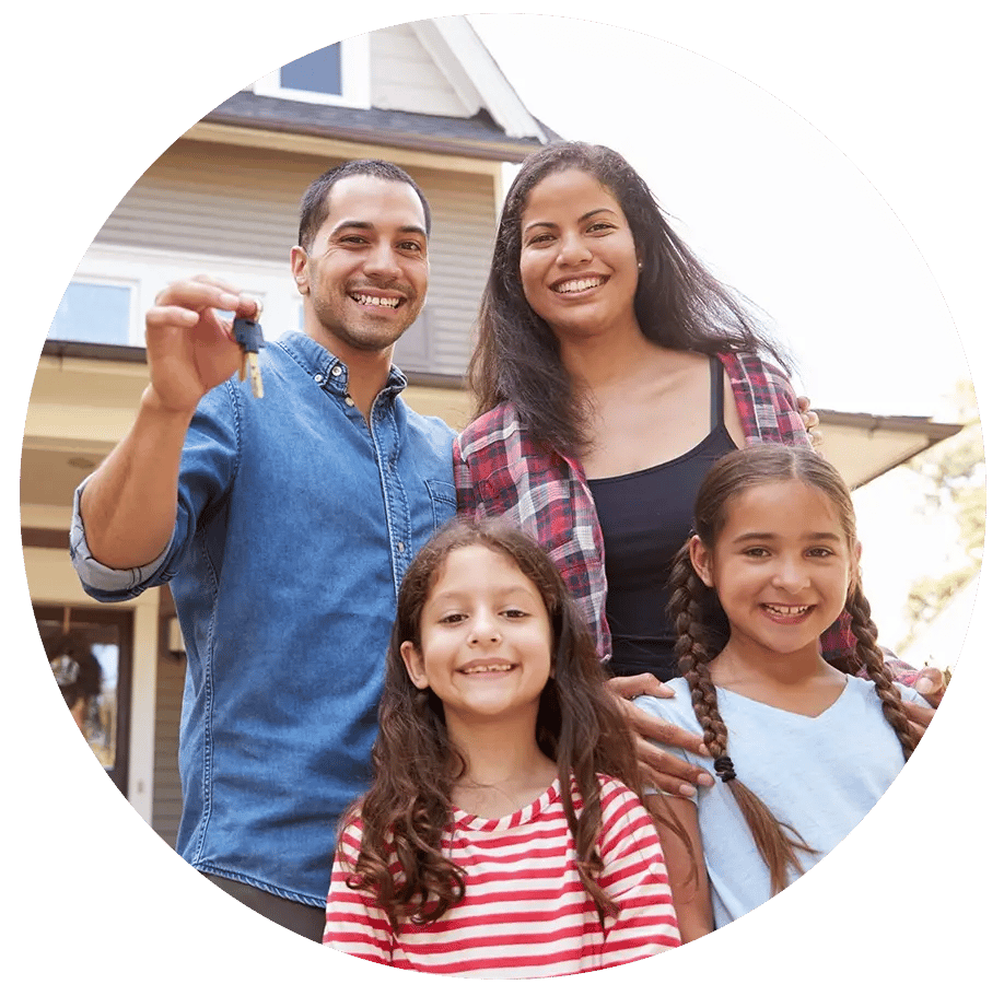 Happy family holding keys to new home. 